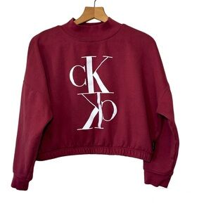 Calvin Klein burgundy crop, mock neck long sleeved sweatshirt. Women’s XL